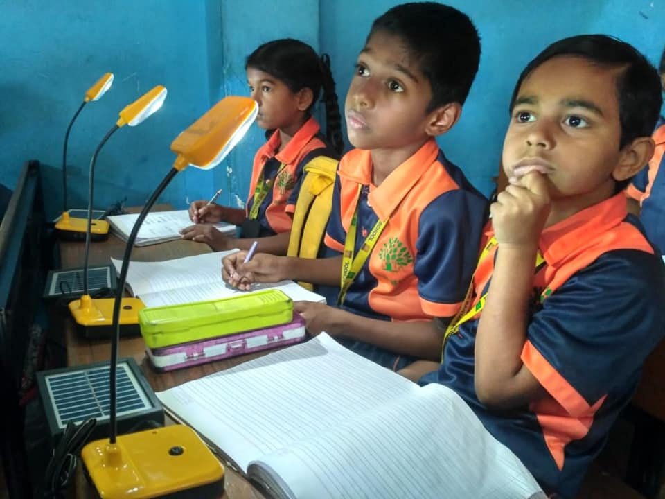 Children learning together in class