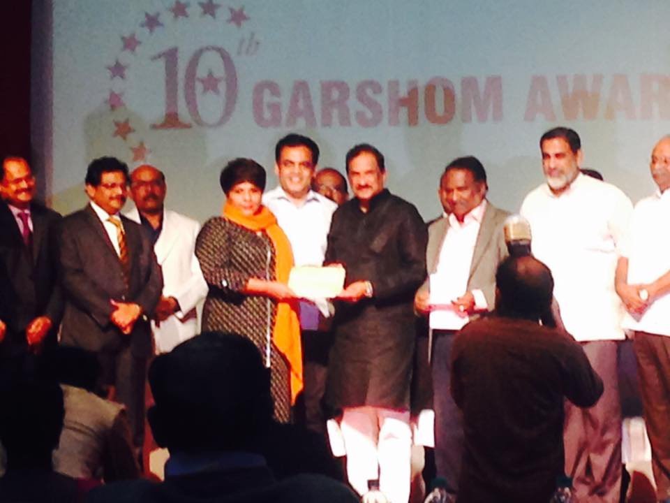 Woman of the Year award receiving from Minister KJ George